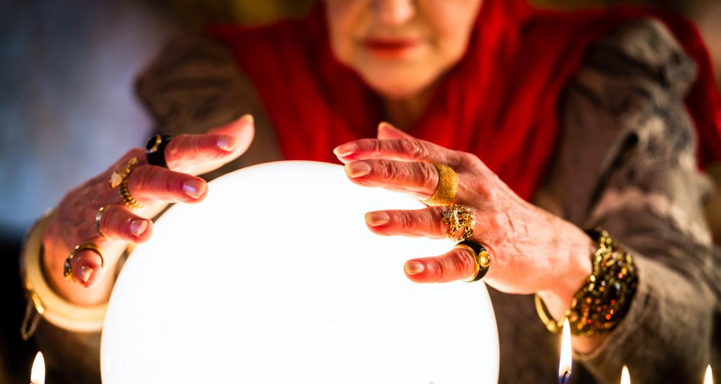 Woman looking in crystal ball