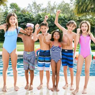 a group of children pose in their swimsuits from kidbox