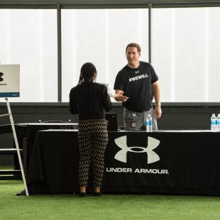 Under Armour recruiter speaks to rise up candidate at the Rise Up career fair