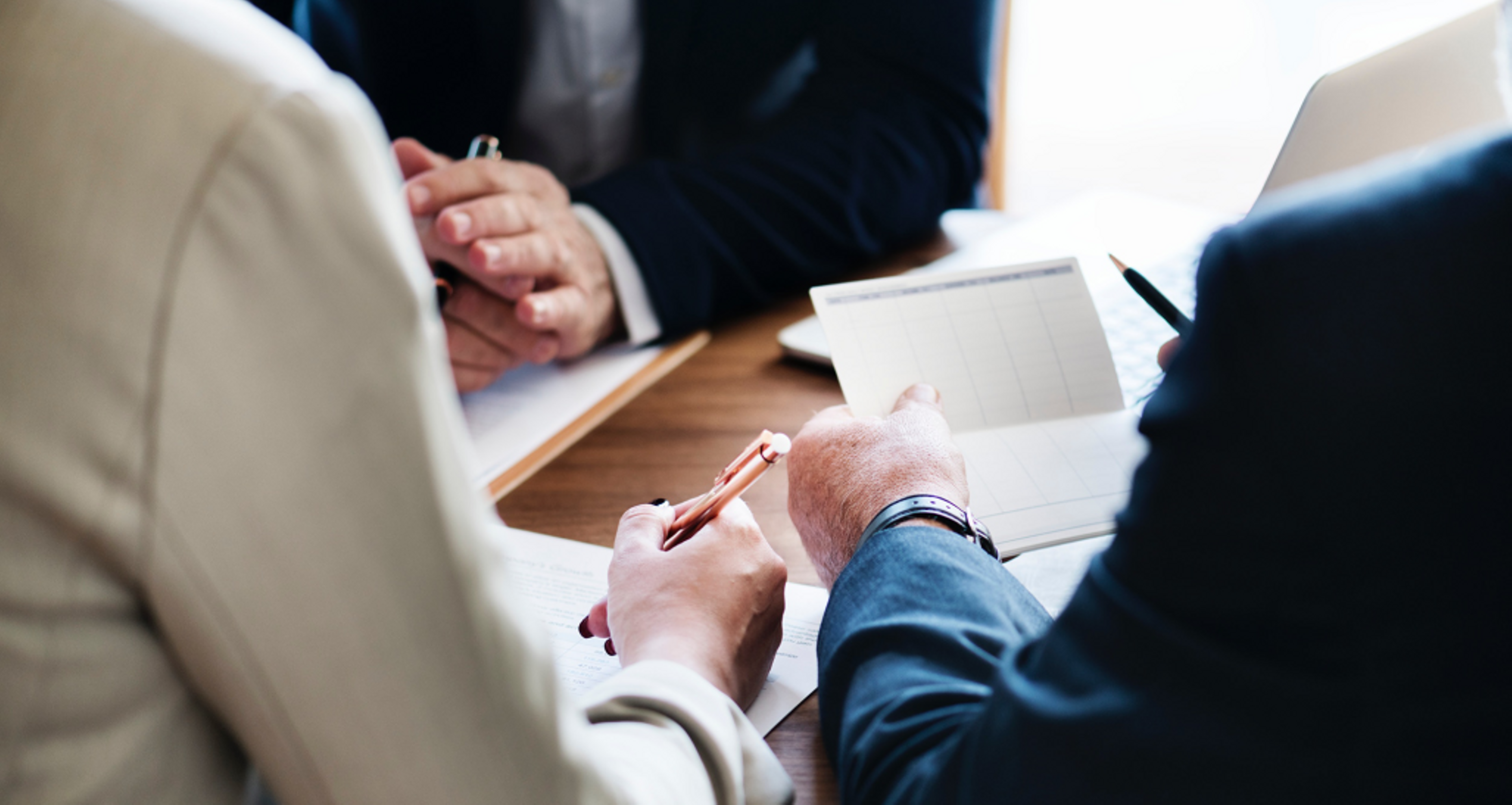 Professionals working at a table.