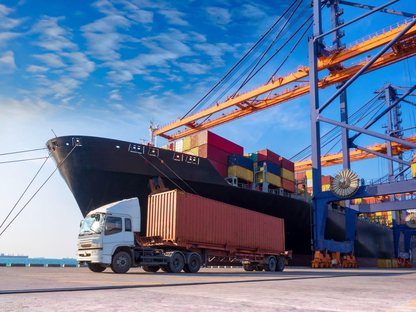 A cargo ship docked at a port.