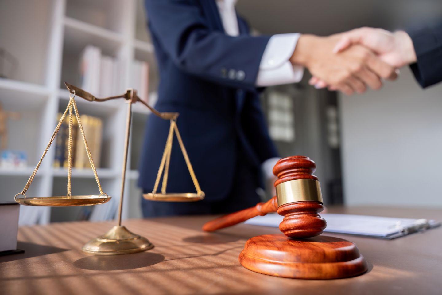 A scale and mallet representing retail law.