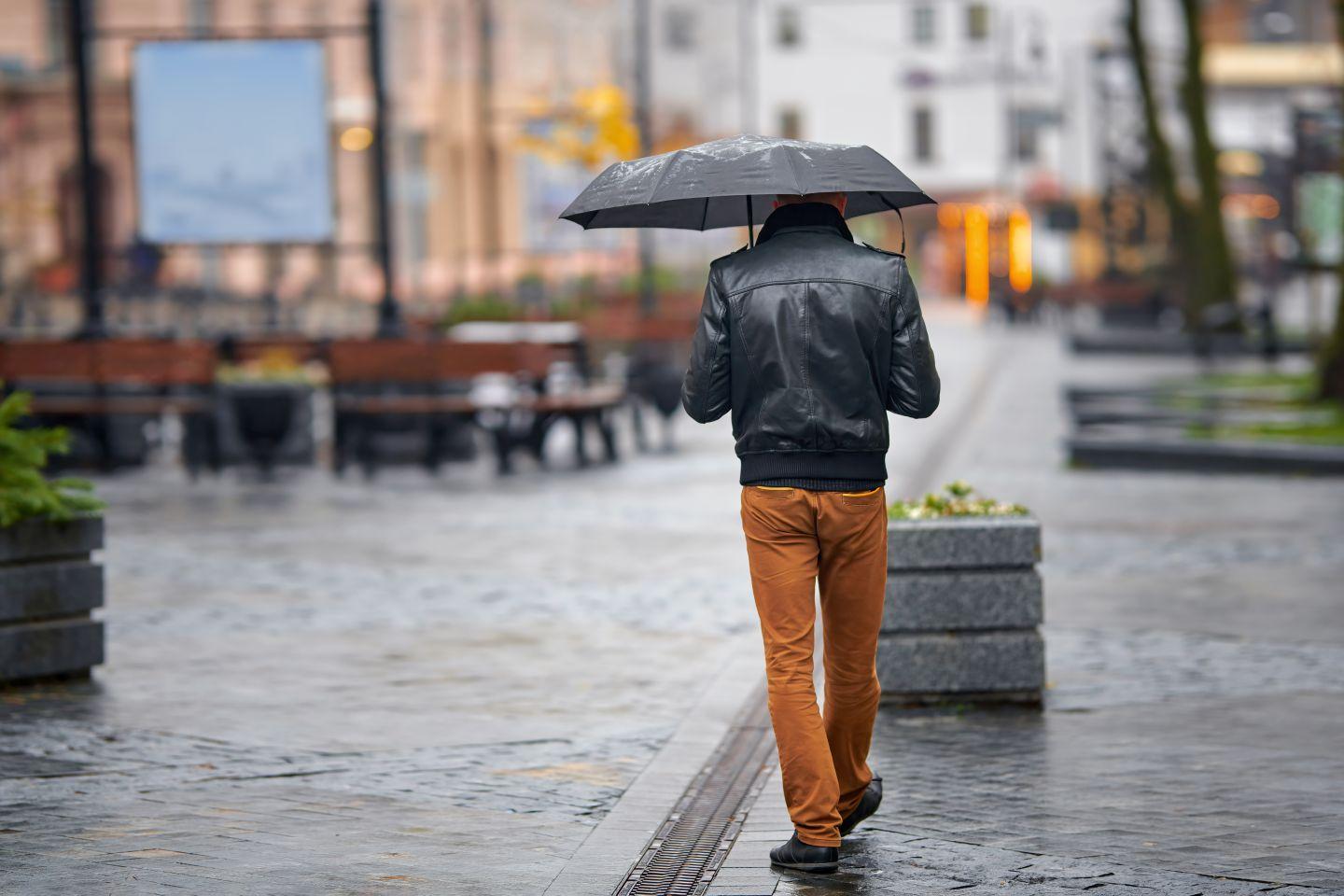 A customer shopping in the rain.