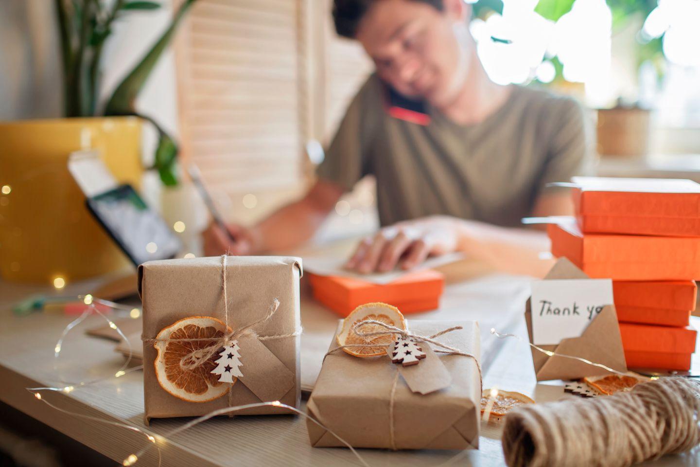 Small business worker wrapping gifts.