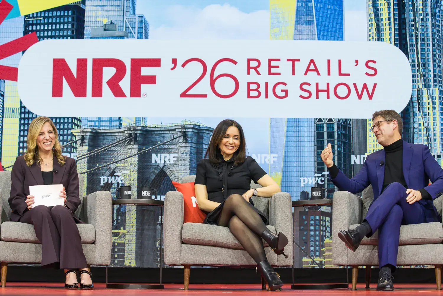 Ali Furman, partner, U.S. Consumer Markets Industry Leader, PwC, Soumia Hadjali, global senior vice-president, client development and digital at Louis Vuitton, and Gonzague de Pirey, chief omnichannel and data officer at LVMH seated on stage, sharing a laugh duing a keynote session at NRF'26.