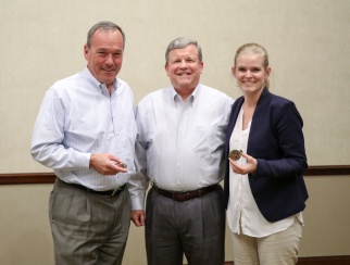 Tom Shull (center) brought ‘The Exchange’ badges for co-hosts Bill Thorne (left) and Sarah Rand (right).