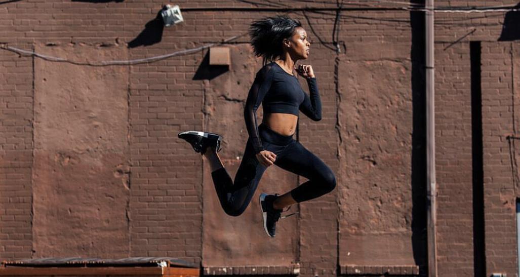 Woman jumping in the air wearing S3 Active 