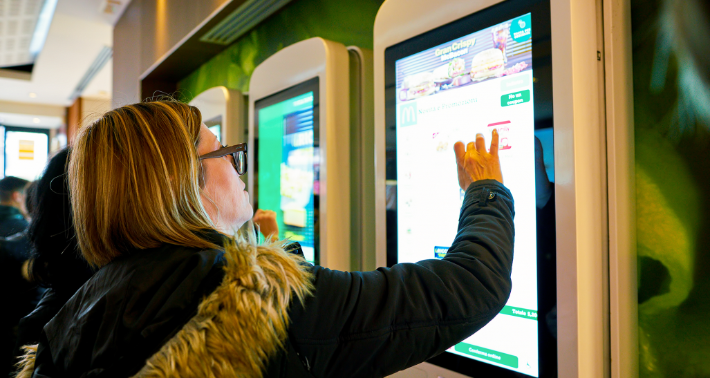 ordering food at a McDonald's self-service kiosk