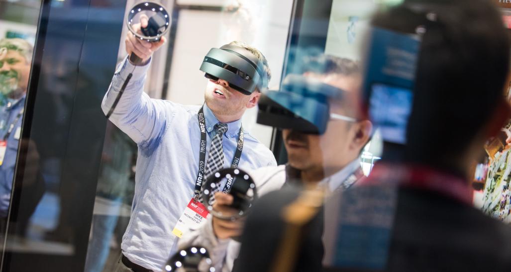 NRF 2019 Expo Hall two attendees testing AR-VR