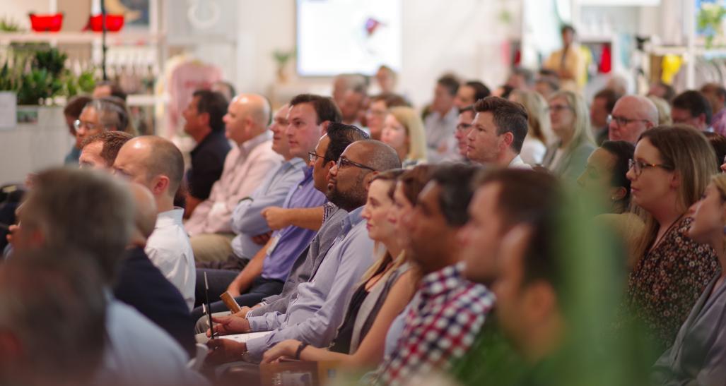 Audience at an event listening to speaker