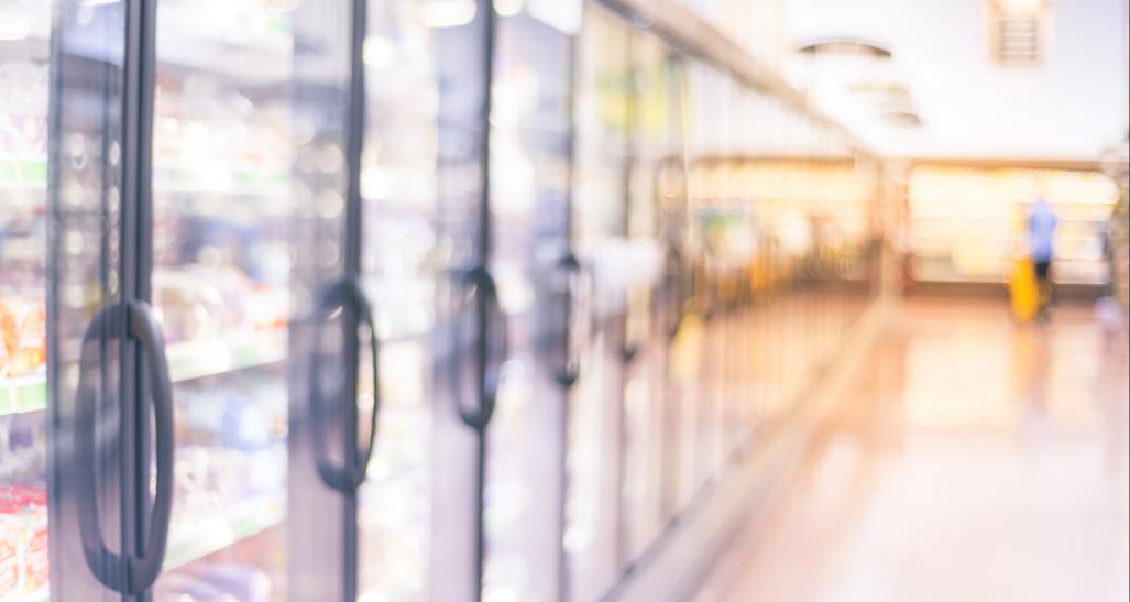 Blurred photo of frozen foods aisle in grocery store