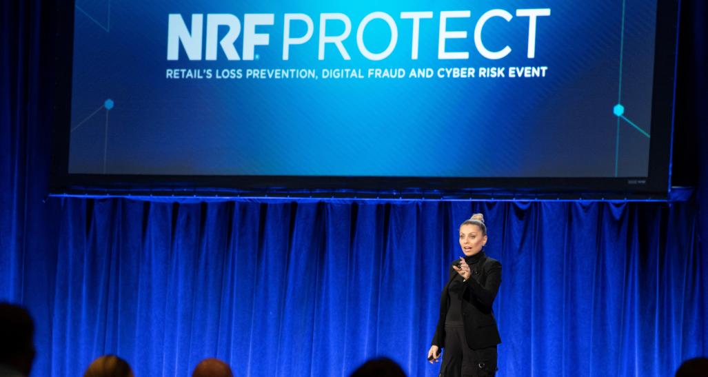 Evy Poumpouras on stage at PROTECT 2022