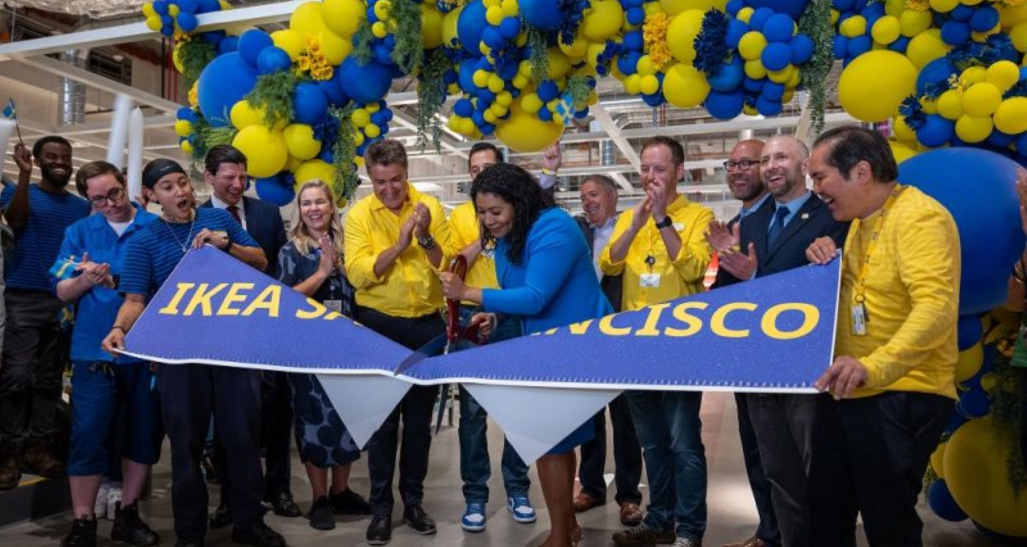 Javier Quiñones, CEO and chief sustainability officer at IKEA U.S., cutting a banner.