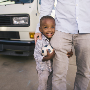 a man and a little boy standing together