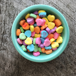 a bowl of heart shaped candy