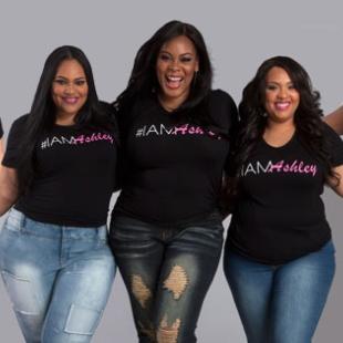 Ashley stewart and her team of ladies pose for a picture