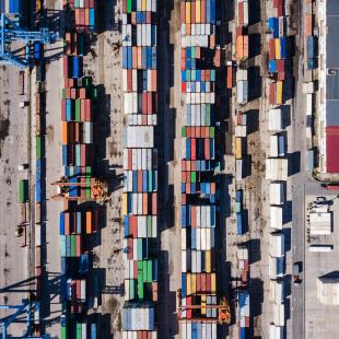 an aerial of shipment trucks at a port