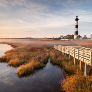 A lighthouse along the grassy plains of North Carolina.