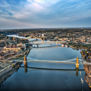 A city skyline showcasing 3 different bridges in Ohio.