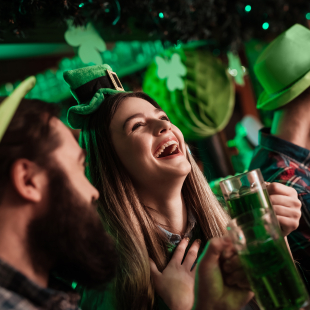 Woman laughing at St. Patrick's day celebrations