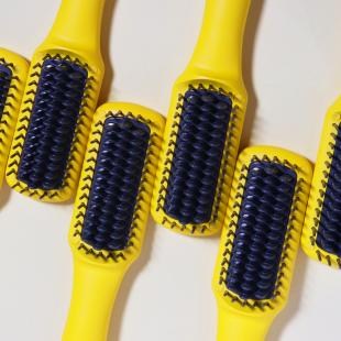 Yellow Drybar hair brushes