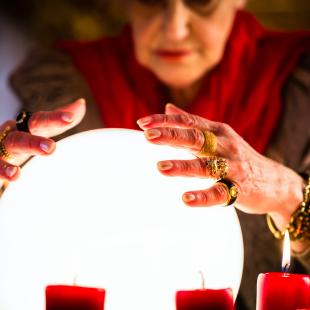 Woman looking in crystal ball