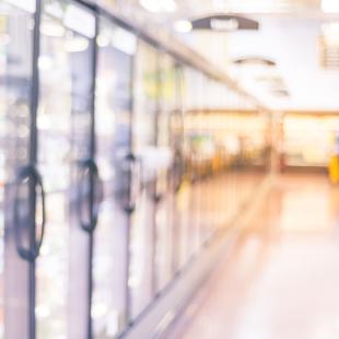 Blurred photo of frozen foods aisle in grocery store