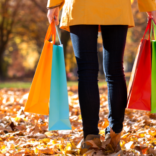 woman holding shopping bags in Fall