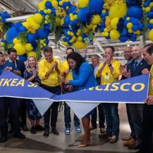 Javier Quiñones, CEO and chief sustainability officer at IKEA U.S., cutting a banner.