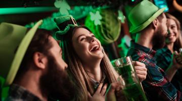 Woman laughing at St. Patrick's day celebrations