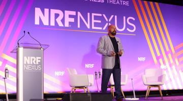 Alex Genov speaking at NRF Nexus 2023.