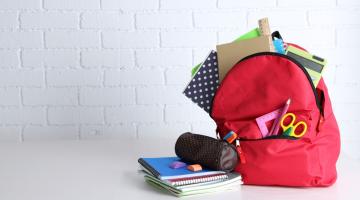 A backpack and school supplies.