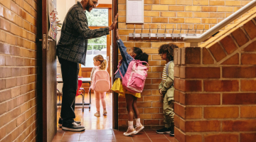 Children entering their classroom. 