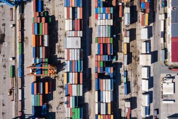 an aerial of shipment trucks at a port