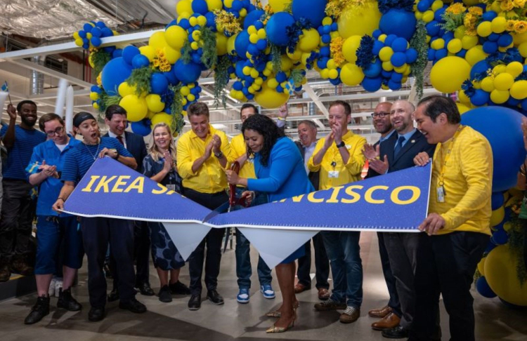 Javier Quiñones, CEO and chief sustainability officer at IKEA U.S., cutting a banner.