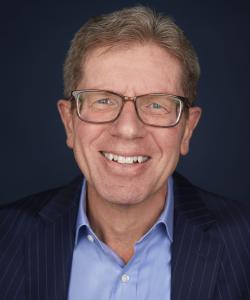 Headshot of Mike George, President and CEO, Qurate Retail Group